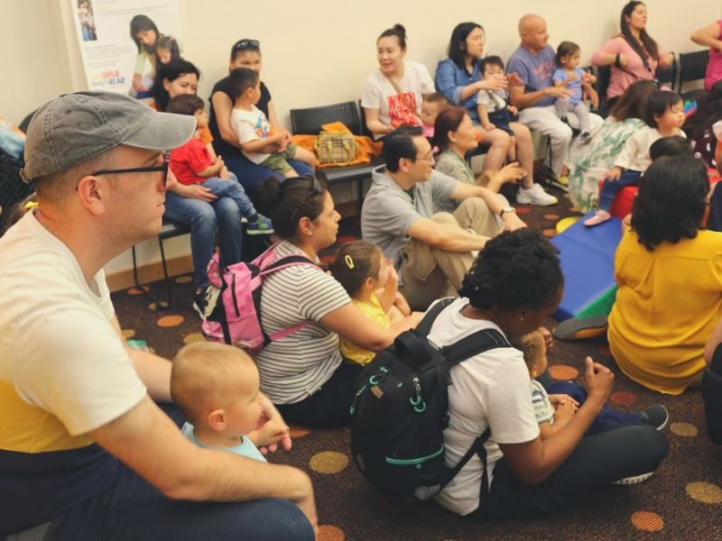 Parents and their small children listened during storytime