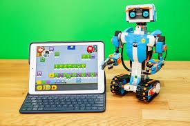 Vernie, the LEGO Boost robot, with a tablet showing the coding needed to operate robot. 